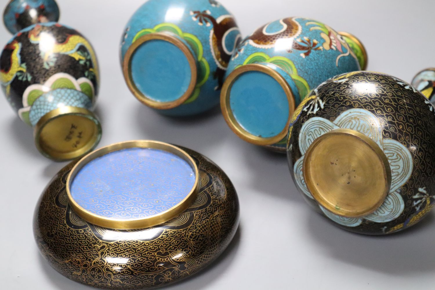 A pair of Chinese cloisonne enamel vases, 17cm and three other cloisonne vessels